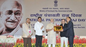 Prime Minister Narendra Modi presented the State (Devolution Index) Awards and E-Panchayat Awards, at the National Panchayati Raj Day function, in New Delhi on April 24, 2015. Union Minister for Rural Development, Panchayati Raj, Drinking Water and Sanitation Chaudhary Birender Singh, the Minister of State for Panchayati Raj Nihalchand and Secretary, Ministry of Panchayati Raj S.M. Vijayanand are also seen.