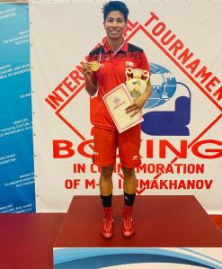 Lovlina celebrates on the podium with her gold medal