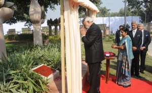 Prime Minister Narendra Modi Paying homage to the commemorating officers who laid down their lives in national service at Heads of Missions Conference, in New Delhi on February 07, 2015. Union Minister for External Affairs and Overseas Indian Affairs Sushma Swaraj is also seen.