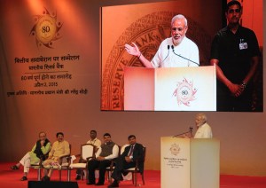 Prime Minister Narendra Modi addressing the Financial Inclusion Conference of RBI, in Mumbai on April 02, 2015. Union Minister for Finance, Corporate Affairs and Information & Broadcasting Arun Jaitley, Governor of Reserve Bank of India, Raghuram Rajan, Governor of Maharashtra C. Vidyasagar Rao and Chief Minister of Maharashtra Devendra Fadnavis are also seen.