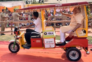 PM Modi riding an e-rickshaw in Varanasi on 1 May 2016