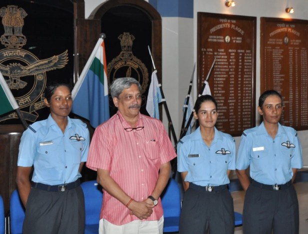 India's Minister for Defence Manohar Parrikar with three newly commissioned women fighter pilots Flying Officer Avani Chaturvedi, Flying Officer Bhavana Kanth, Flying Officer Mohana Singh, at Air Force Academy, Hyderabad on June 18, 2016.