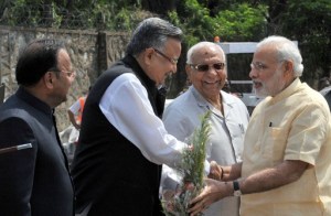  Prime Minister Narendra Modi being welcomed by Governor of Chhattisgarh Balramji Das Tandon and the Chief Minister of Chhattisgarh Raman Singh, at Jagdalpur Airport, in Chhattisgarh on May 09, 2015.
