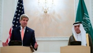 Saudi Foreign Minister Adel al-Jubeir looks on as U.S. Secretary of State addresses reporters during a news conference at Riyadh Air Base in Riyadh, Saudi Arabia, on May 7, 2015, following meetings with King Salman bin Abdelaziz Al Saud, Crown Prince Mohammed bin Nayef, and the Foreign Minister.