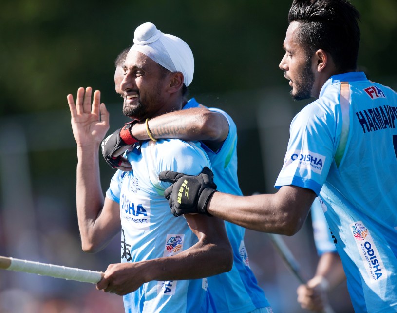 Mandeep Singh celebrates a goal with his teammates