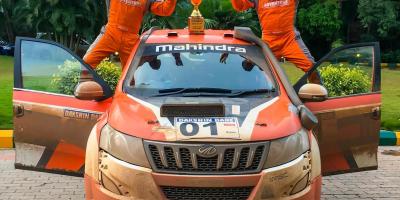 Gaurav Gill (R) with his co-driver Musa Sherif (L) with the winner's trophies