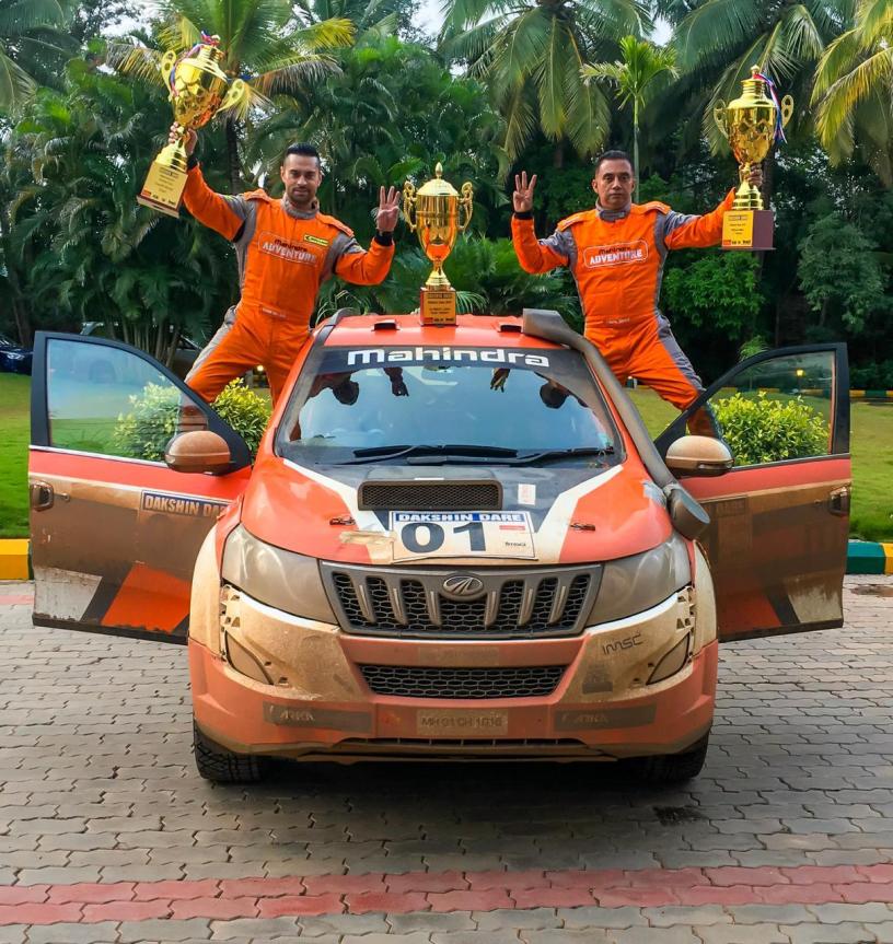 Gaurav Gill (R) with his co-driver Musa Sherif (L) with the winner's trophies